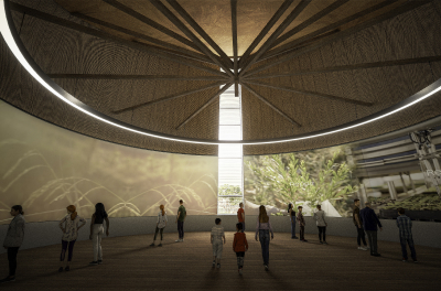 Image of a large circular hall with a high ceiling and projected images on the curved walls